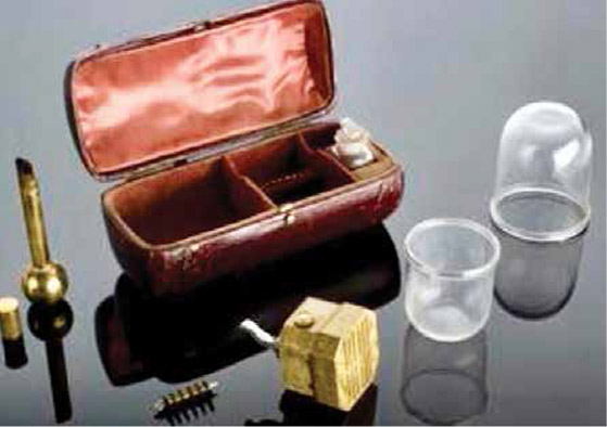 A leather-bound cupping case with a cupping torch and cover on the left. London, 1801-1900.